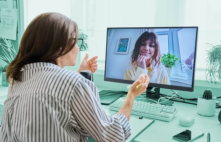 woman on a computer in a virtual meeting